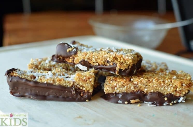 Quinoa Coconut Granola Bar Recipe. Our kids already love granola bars, but once you add quinoa, your kids also get fiber and protein!